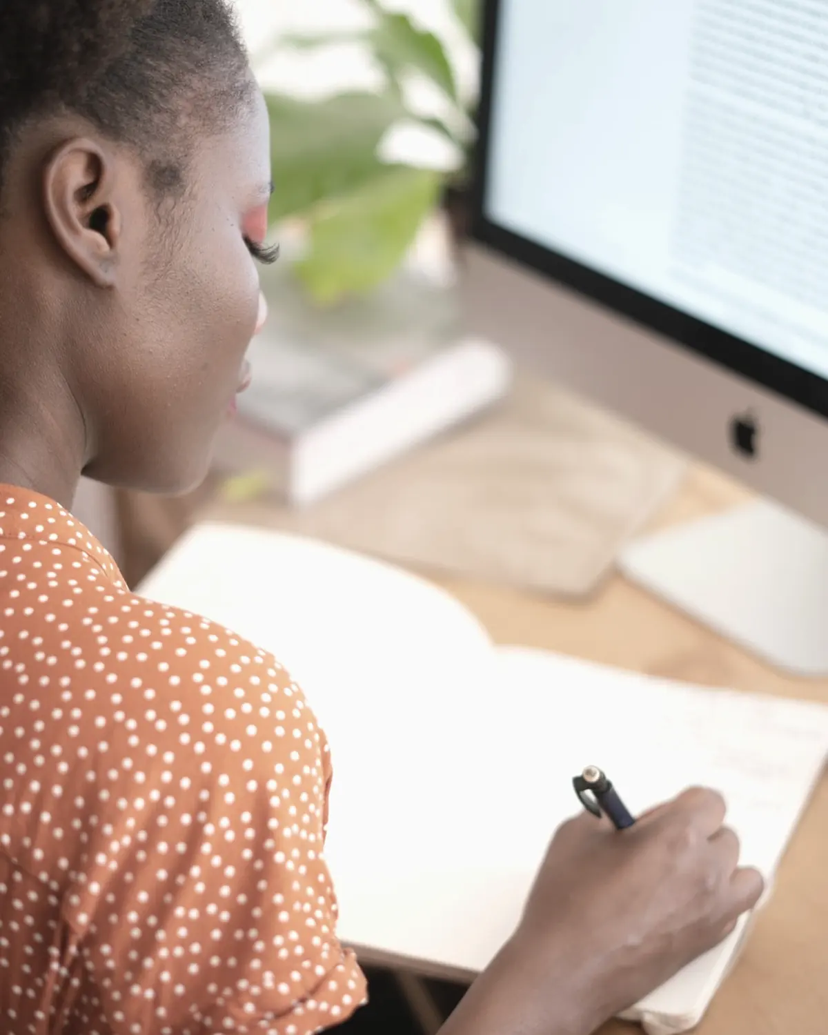 A creator shaping an idea at a desk